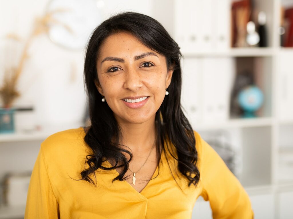 Woman smiling in living room